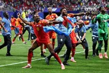 احتفال لاعبي منتخب الكونغو الديمقراطية بعد التأهل لدور الـ32 من كأس العالم